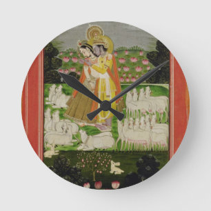 Radha and Krishna embrace in an idealised landscap Round Clock