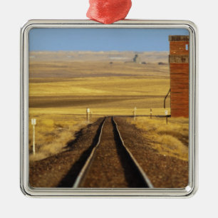 Railroad tracks lead to old granary at Collins Metal Ornament