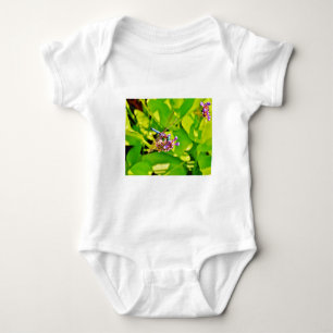 Rainbow coloured Dragonfly  on a purple pink flowe Baby Bodysuit