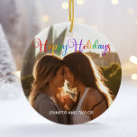 Rainbow Happy Holidays LGBTQ Couple Photo Ceramic Ornament<br><div class="desc">Elegant Happy Holidays photo ornament with beautiful rainbow cursive typography. This modern LGBTQ holiday couple photograph gift features gorgeous script and your name in white over the full bleed picture of an LGBT couple. Personalize this cute keepsake Christmas ornament with your favourite photograph.</div>