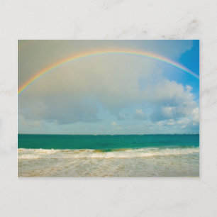 Rainbow over ocean postcard