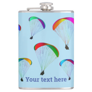 Rainbow parachutes on pale sky blue - paraglider hip flask