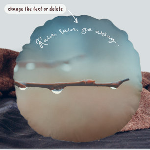 Raindrops on a tree branch round pillow