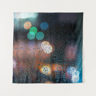 Raindrops on window, night city view through windo tapestry