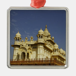 Rajasthan, India A woman standing at and accient Metal Ornament