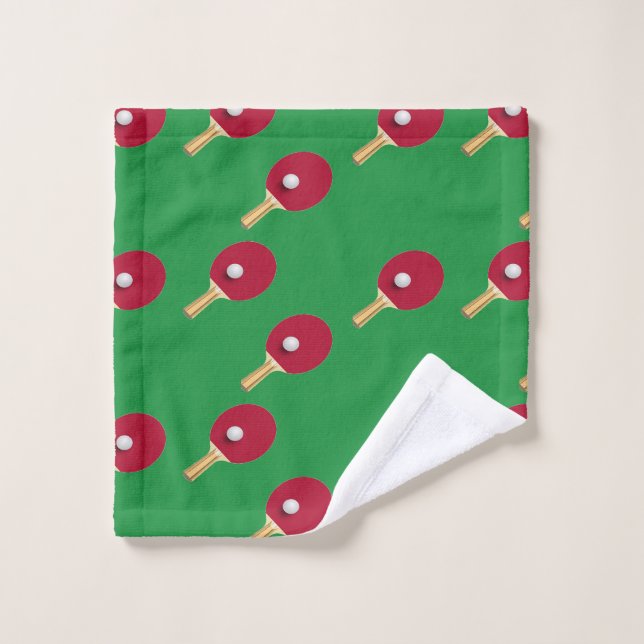 Raquette de ping-pong et boule sur vert (Gant de toilette)