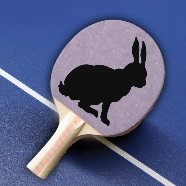 Raquette De Ping Pong Lapin noir Silhouette Lapin de Pâques (Black silhouette sitting rabbit on purple marble look background on ping pong paddle.)