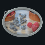 Raspberries and Blueberries Oval Belt Buckle<br><div class="desc">"Fresh raspberries and blueberries.
Image © Angelika Stern"</div>