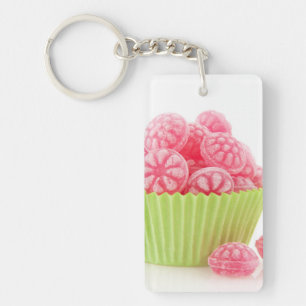 Raspberry tasty candy sweets in green cup cake keychain