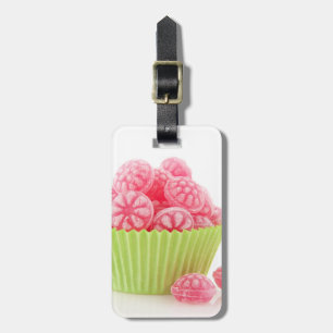 Raspberry tasty candy sweets in green cup cake luggage tag