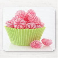 Raspberry tasty candy sweets in green cup cake