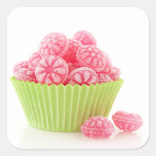 Raspberry tasty candy sweets in green cup cake square sticker