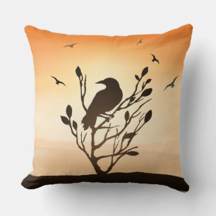 Raven at sunset throw pillow