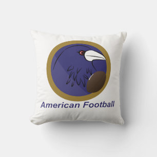 Raven with american football ball throw pillow