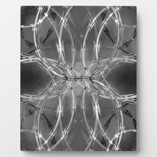Razor wire against dark clouds plaque (Front)