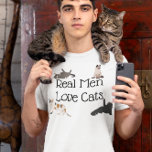 Real Men Love Cats T-Shirt<br><div class="desc">This design was created though digital art. You may change the style of this shirt by choosing More > under the style option. It may be personalized by clicking the customize button and changing the colour, adding a name, initials or your favourite words. Contact me at colorflowcreations@gmail.com if you with...</div>