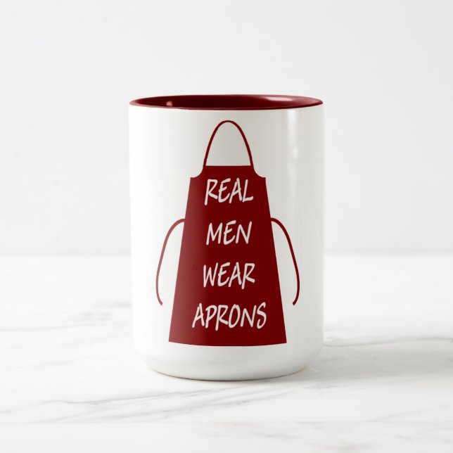 Real Men Wear Aprons (Red) Two-Tone Coffee Mug (Center)