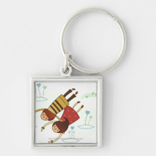 Rear view of a couple flying together keychain