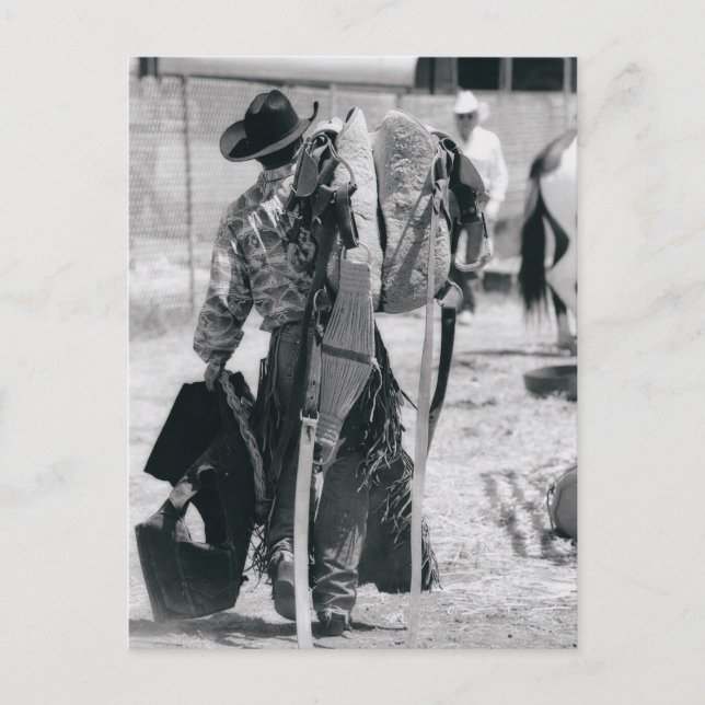 Rear view of cowboy hauling gear postcard (Front)