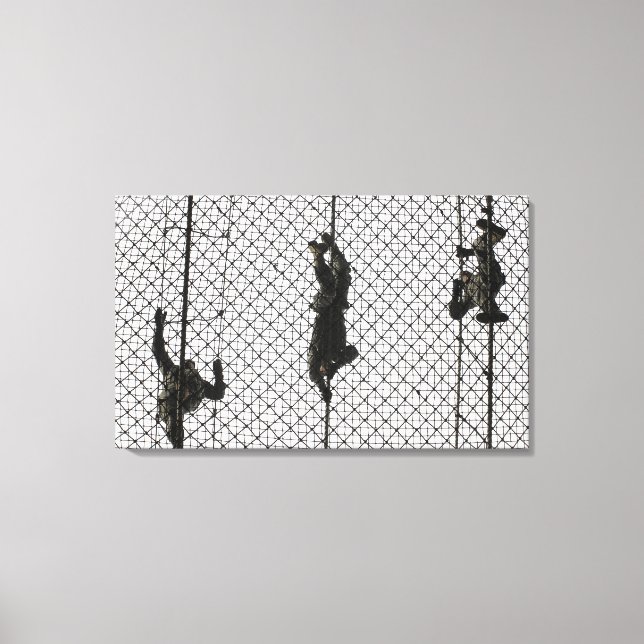 recruits completing an obstacle canvas print (Front)