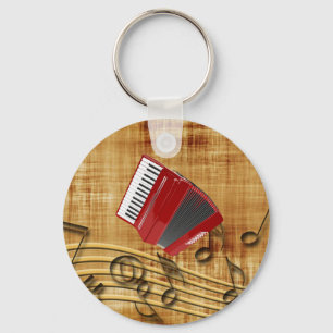 Red accordion, black notes, gold background keychain