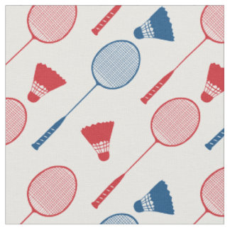 Red and blue badminton rackets on white fabric