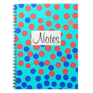 Red and blue dots on light blue notebook