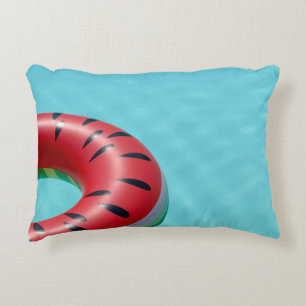 Red and green lifebuoy on swimming pool accent pillow