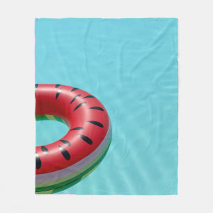Red and green lifebuoy on swimming pool fleece blanket