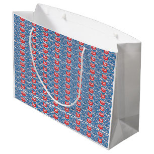 Red and orange paint swirls together, creating a v large gift bag