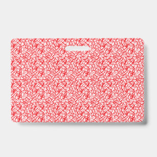 Red and orange wrapping paper with a geometric mot badge