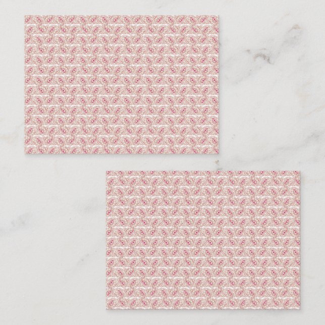 Red and pink textiles laid over a patterned rug wi appointment card (Front/Back)