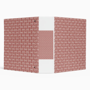 Red and pink textiles laid over a patterned rug wi binder