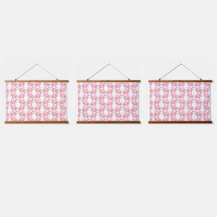 Red and pink wrapping paper featuring a repeating hanging tapestry