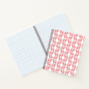 Red and pink wrapping paper featuring a repeating  notebook