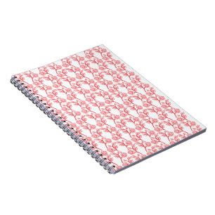 Red and pink wrapping paper featuring a repeating notebook