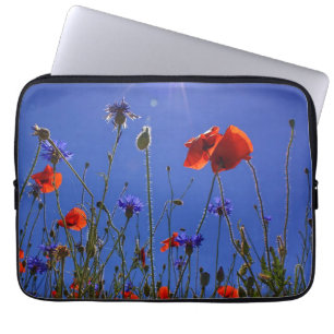 red and purple roses embracing a blue sky and sun laptop sleeve