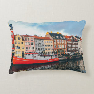 RED AND WHITE CONCRETE BUILDING ACCENT PILLOW