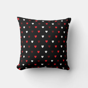 Red and white hearts on black throw pillow