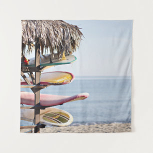 Red and white surfboard in brown wooden rack tapestry