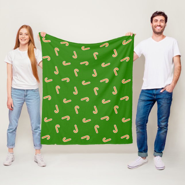 Red and yellow candy canes green fleece blanket (In Situ)
