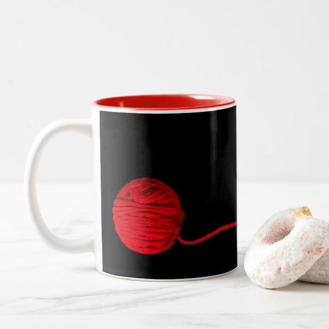red ball of yarn on black for knitter Two-Tone coffee mug (With Donut)