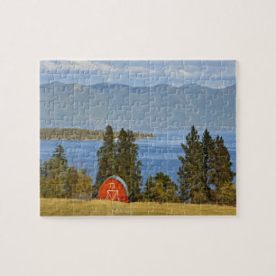 Red barn sits along scenic Flathead Lake near Jigsaw Puzzle