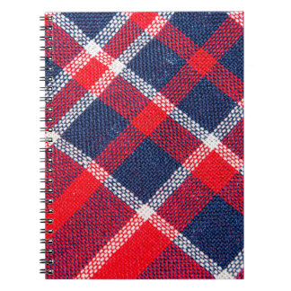 Red-blue chequered woollen texture. notebook