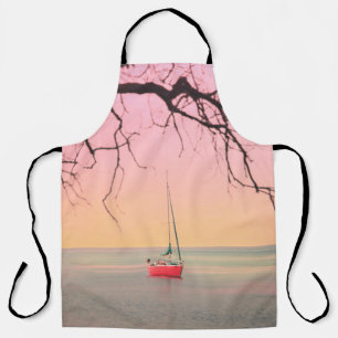 RED BOAT ON BEACH DURING SUNSET APRON