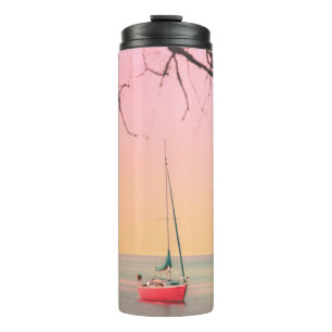 RED BOAT ON BEACH DURING SUNSET THERMAL TUMBLER