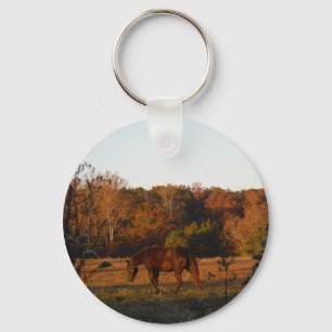 Red  Brown horse, autumn woods. Keychain
