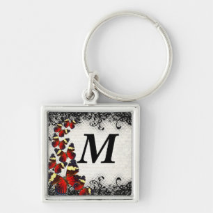 Red butterflies on black lace keychain