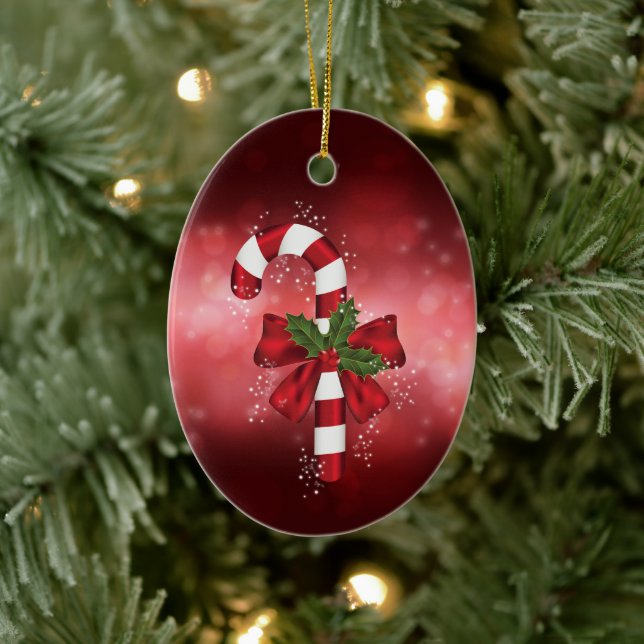 Red Candy Cane On A Red Bokeh Background Ceramic Ornament (Tree)