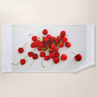 Red Cherries in Natural Light Lay on White Beach Towel